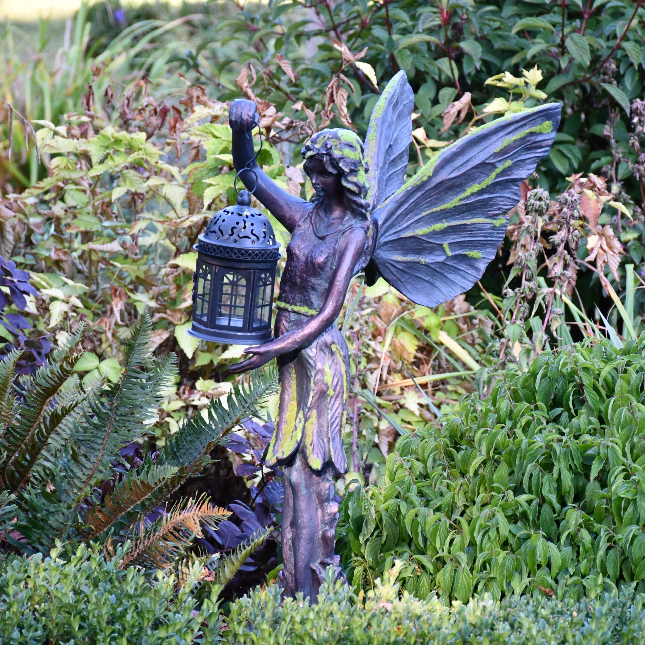 mossy fairy holding lantern garden ornament