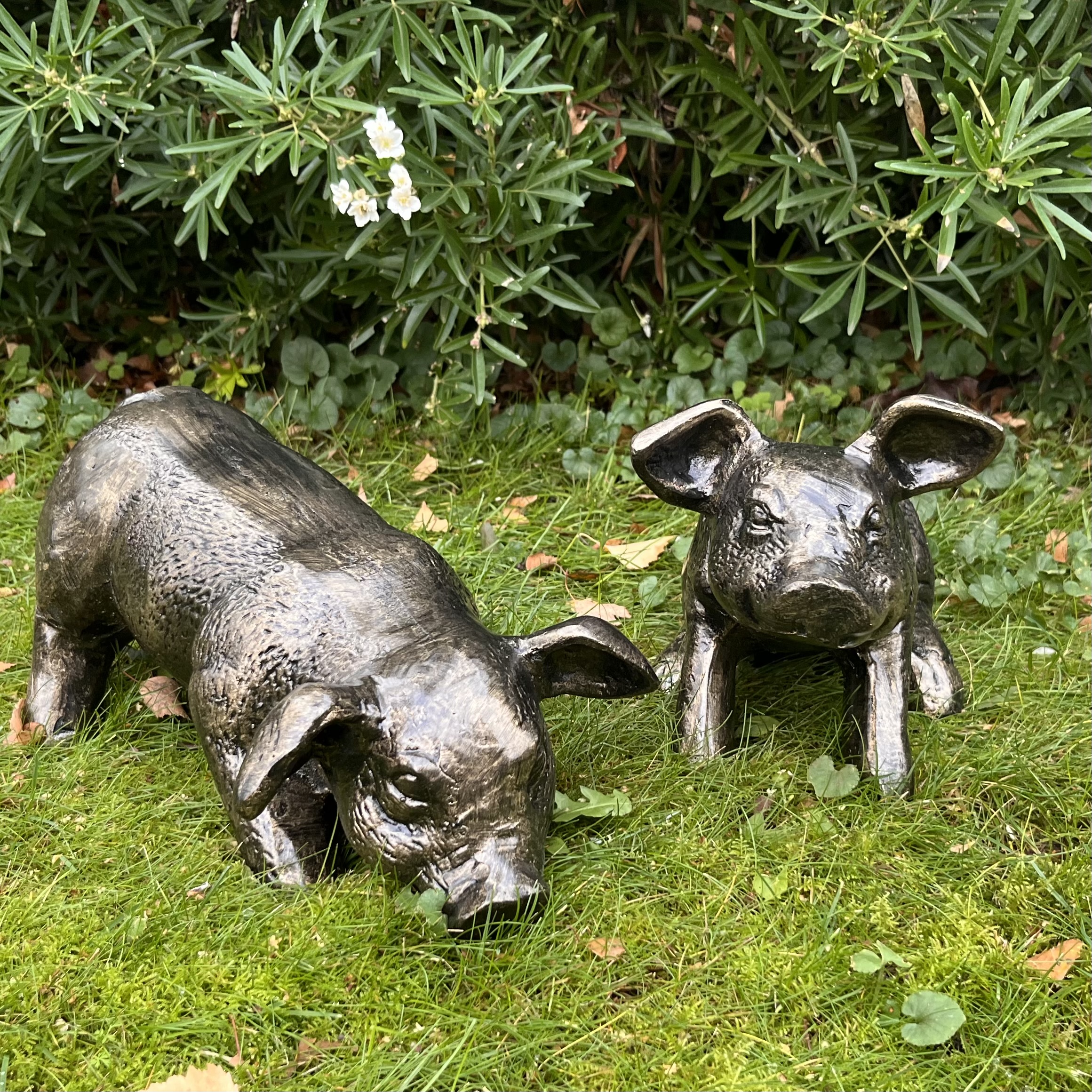 cast recycled aluminium piglet garden statues