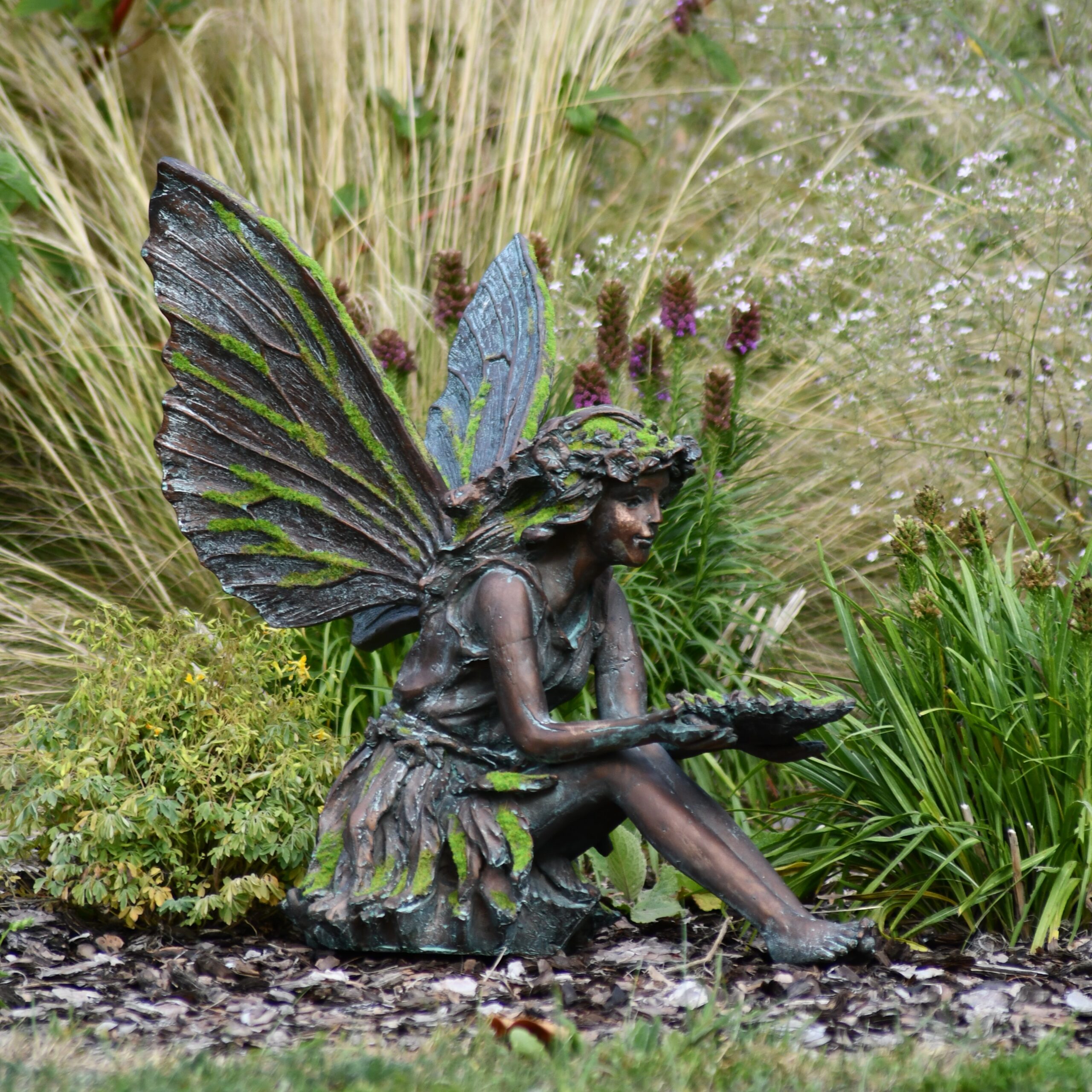 mossy fairy sitting garden statue