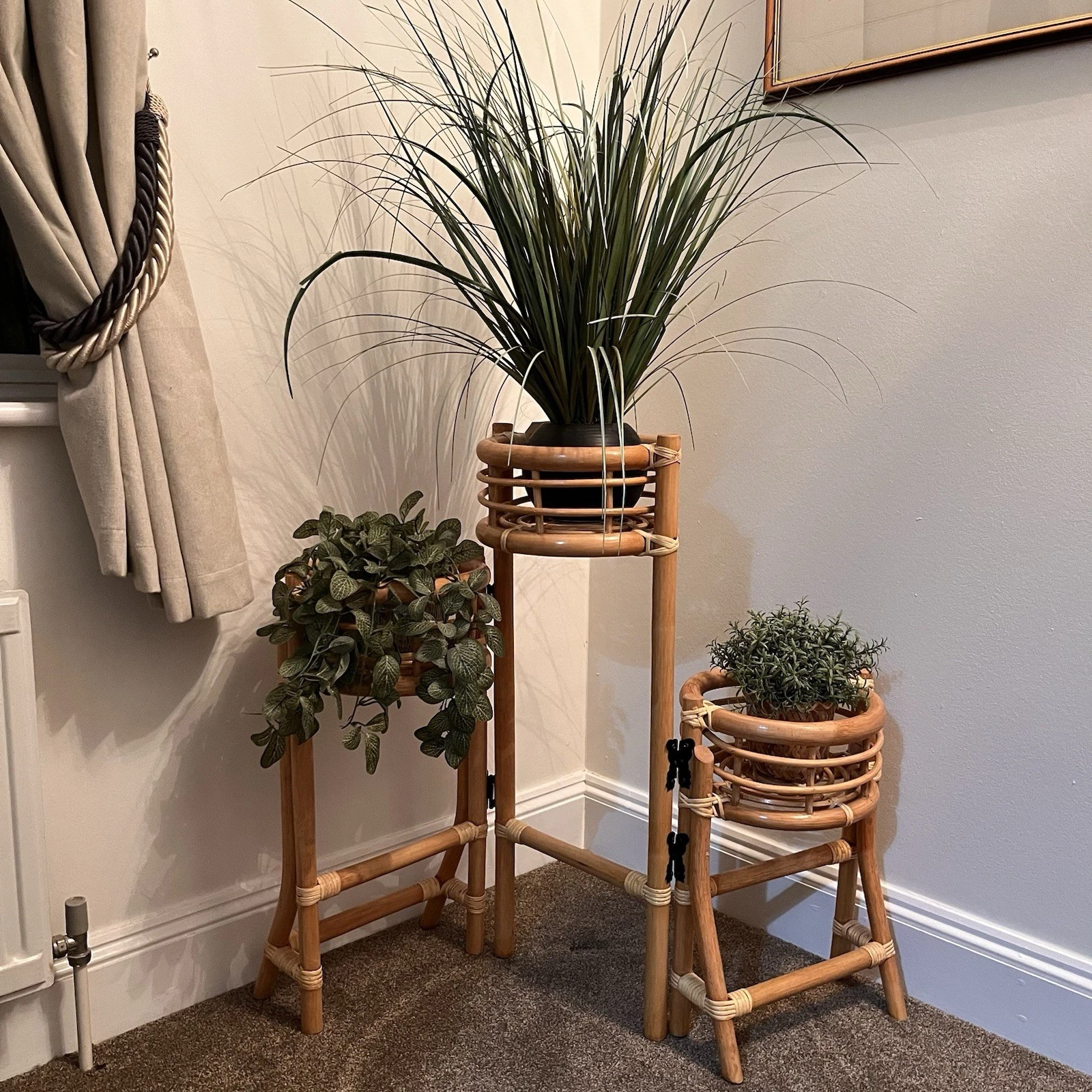 This 3 pot folding plant stand made from cane/wicker,