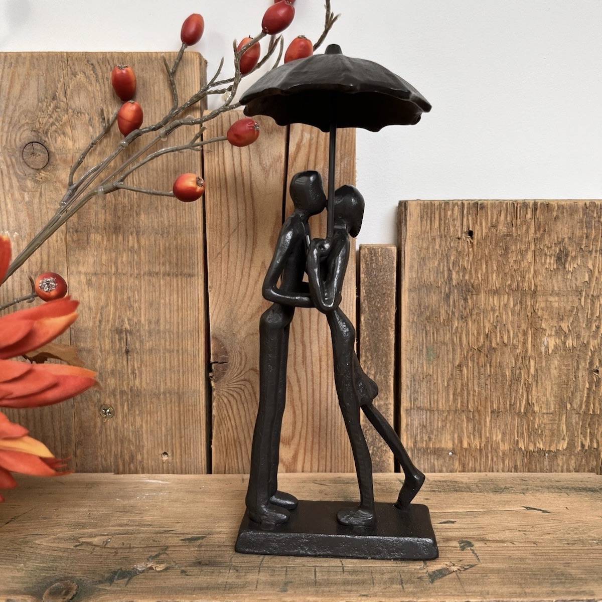 home ornament of couple under an umbrella